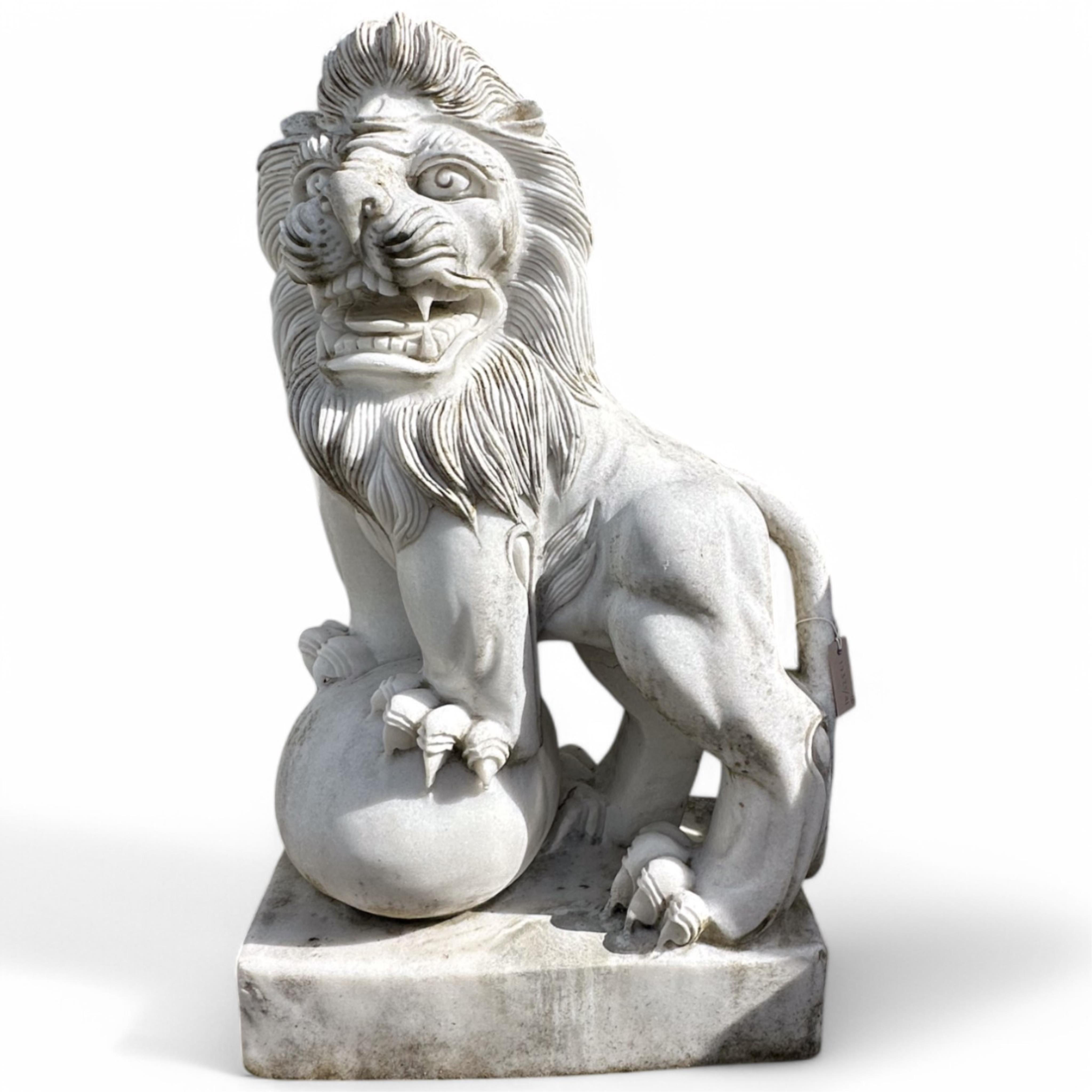 A pair of reconstituted white marble models of lions rampant